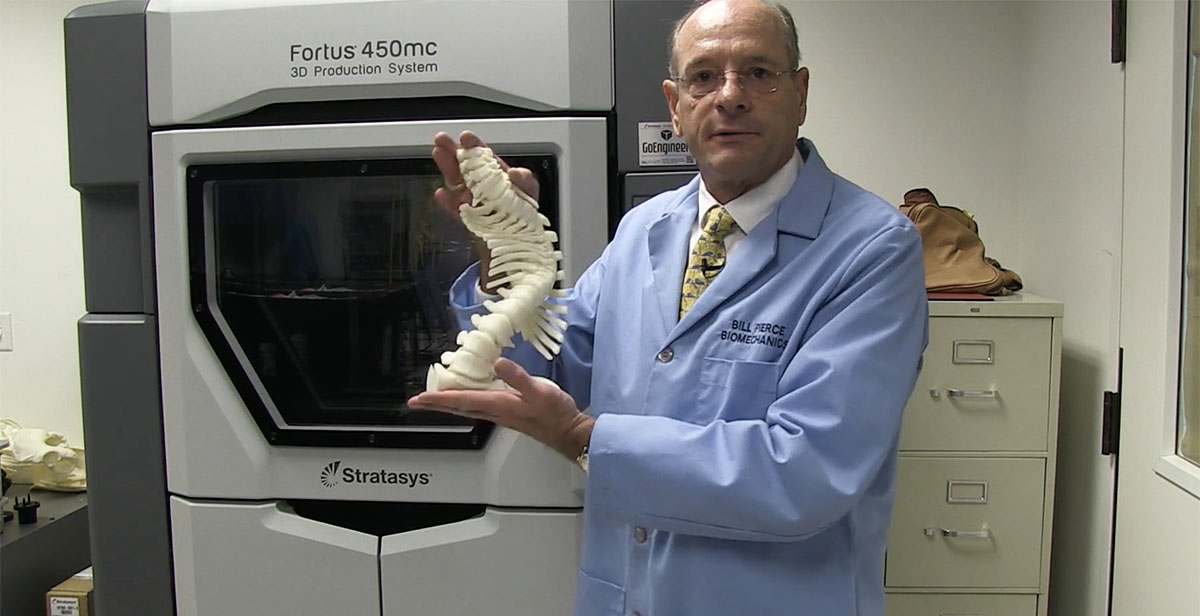 Bill Pierce showing off a 3D model of a spine.