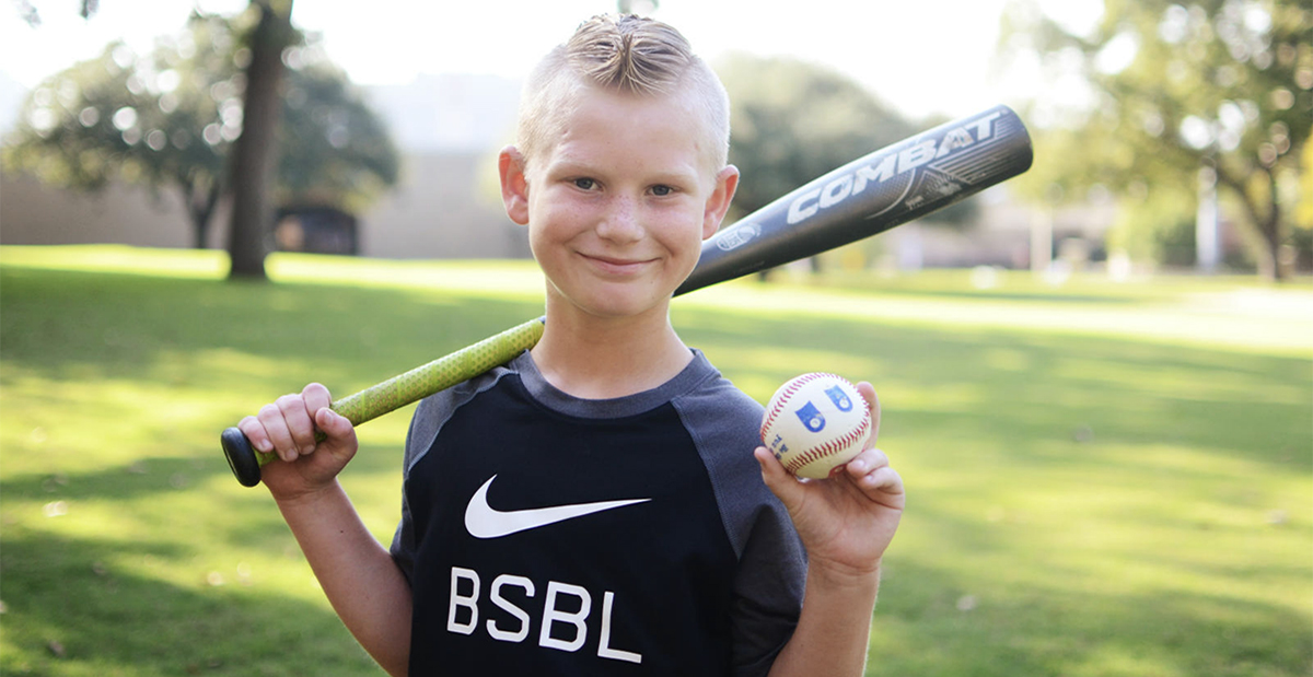 blonde haired boy with baseball bat and baseball