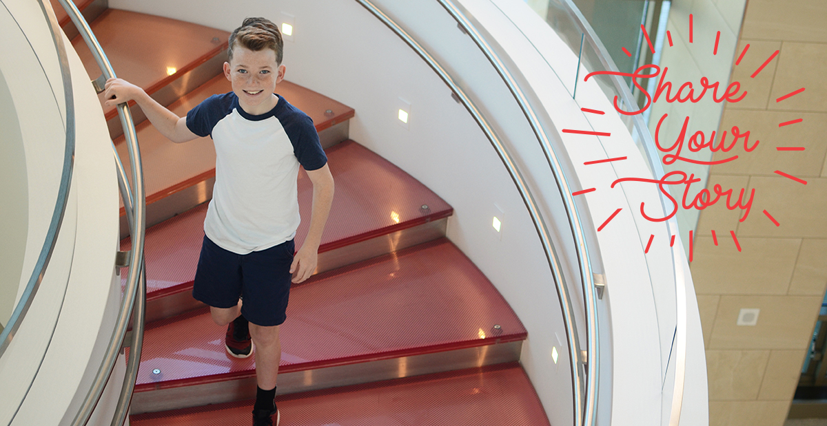 Aidan on the stairs at the Frisco campus
