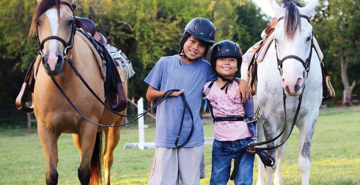 Patients from Texas Scottish Rite Hospital for Children go horseback riding