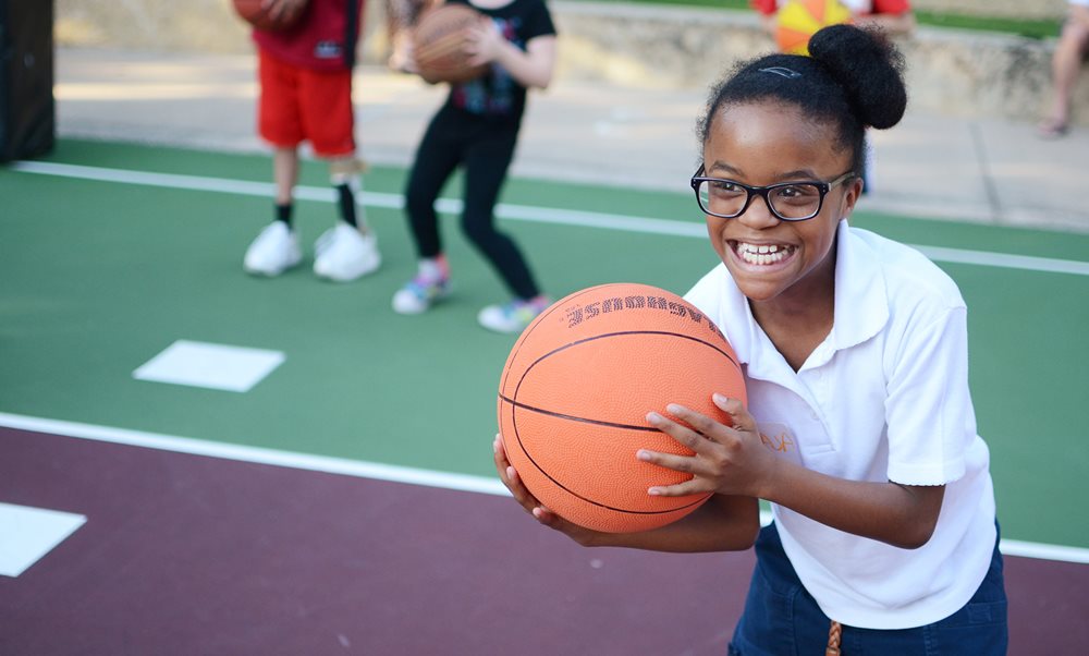 Pediatric patient playing basketball at Scottish Rite for Children 