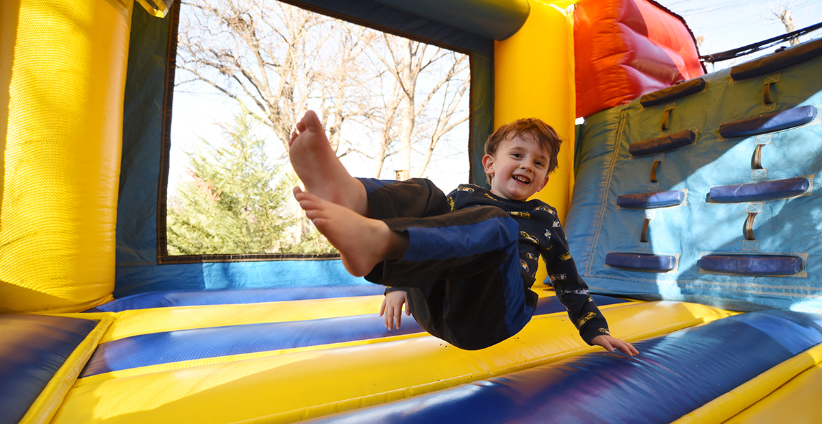 Patient jumping in a bounce house